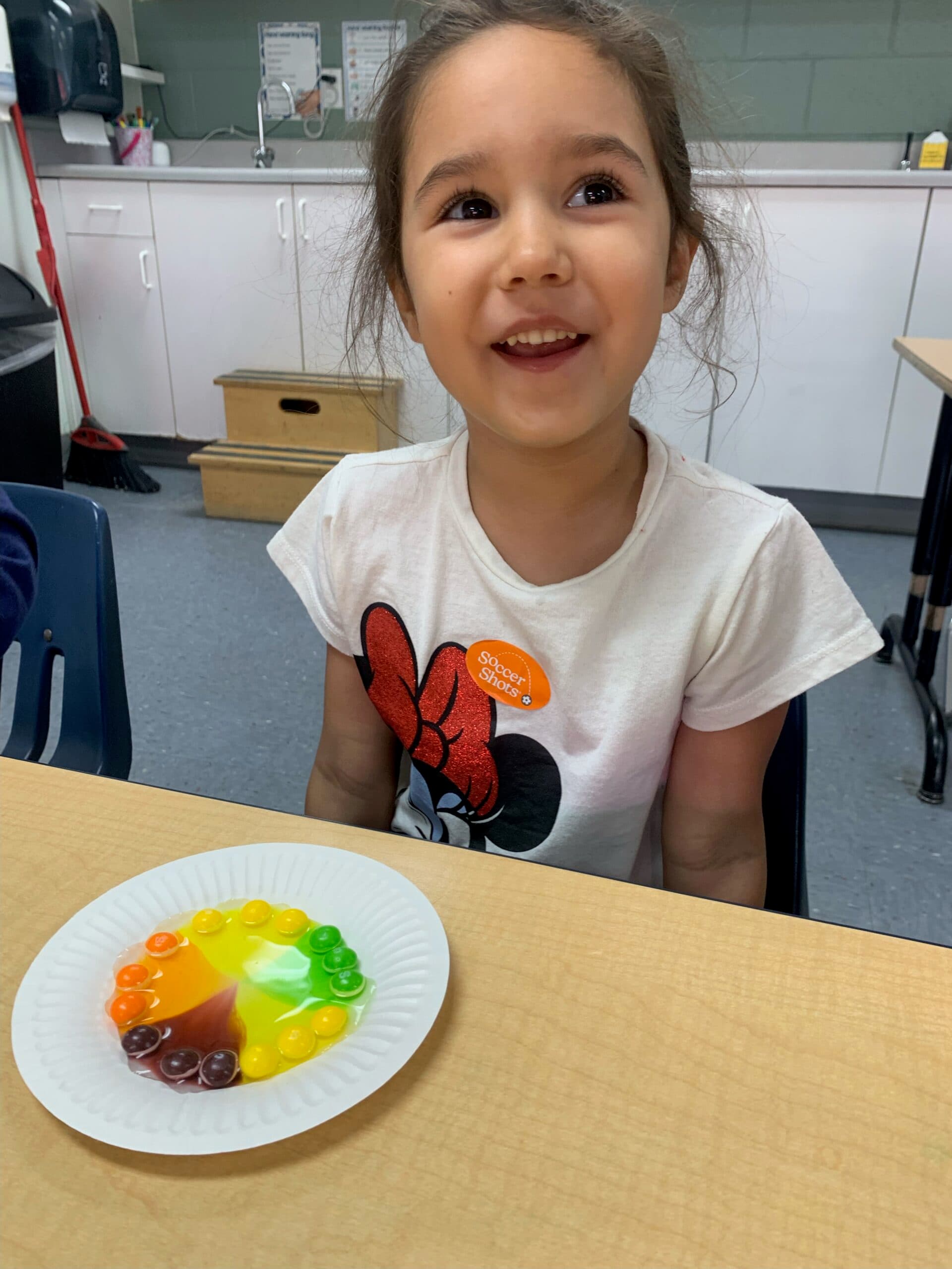 Pre-K student writing letters