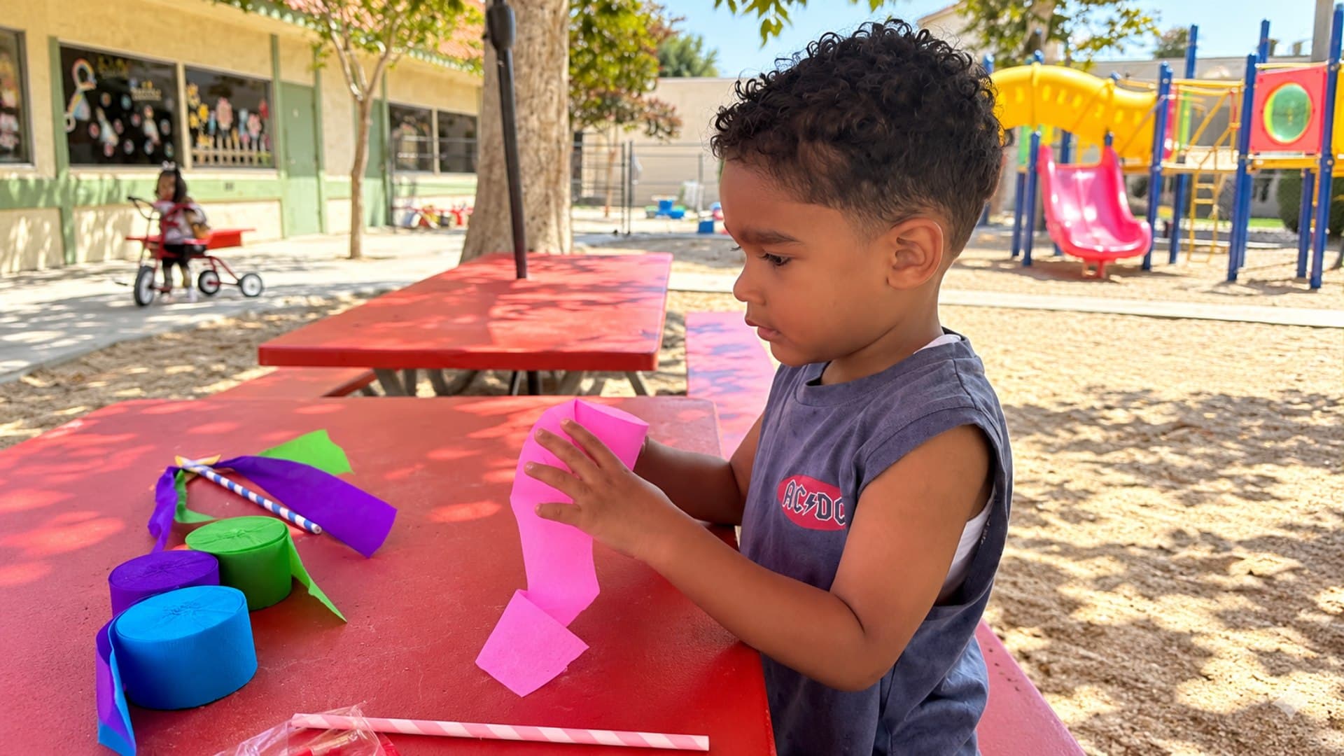 A young student playing chess during after-school enrichment