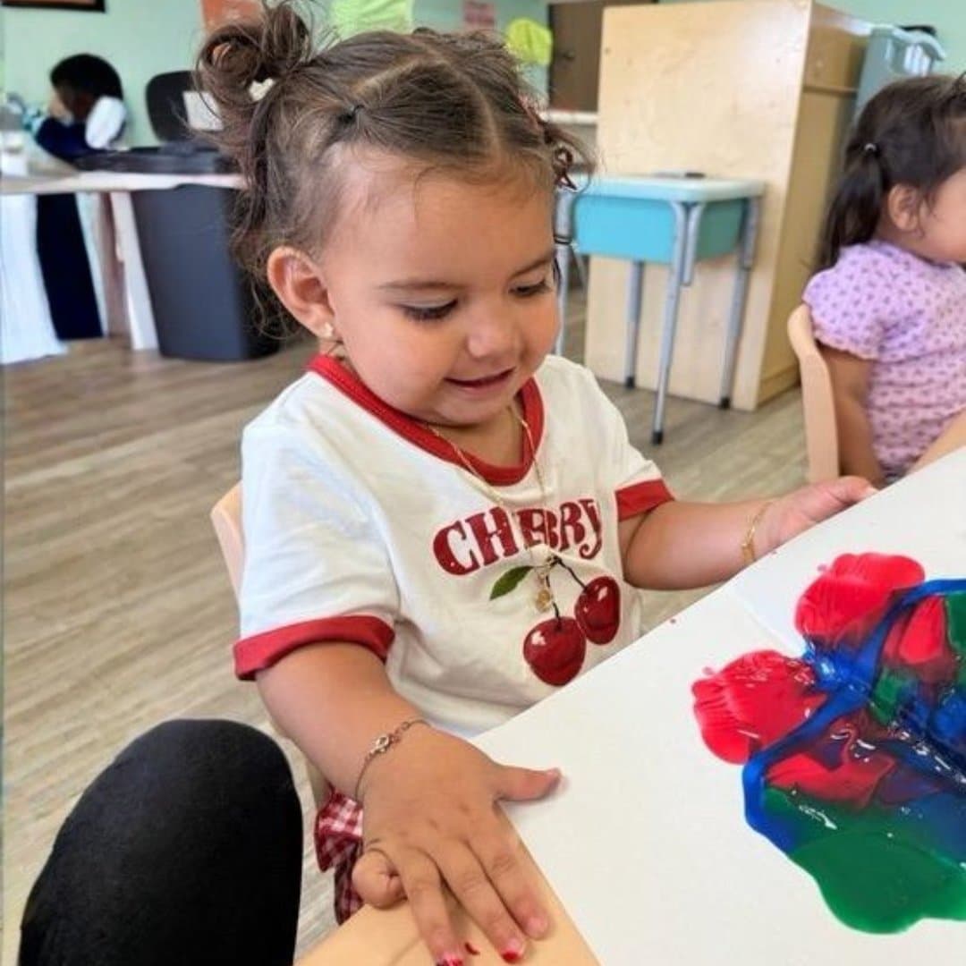 Toddler finger-painting during art time