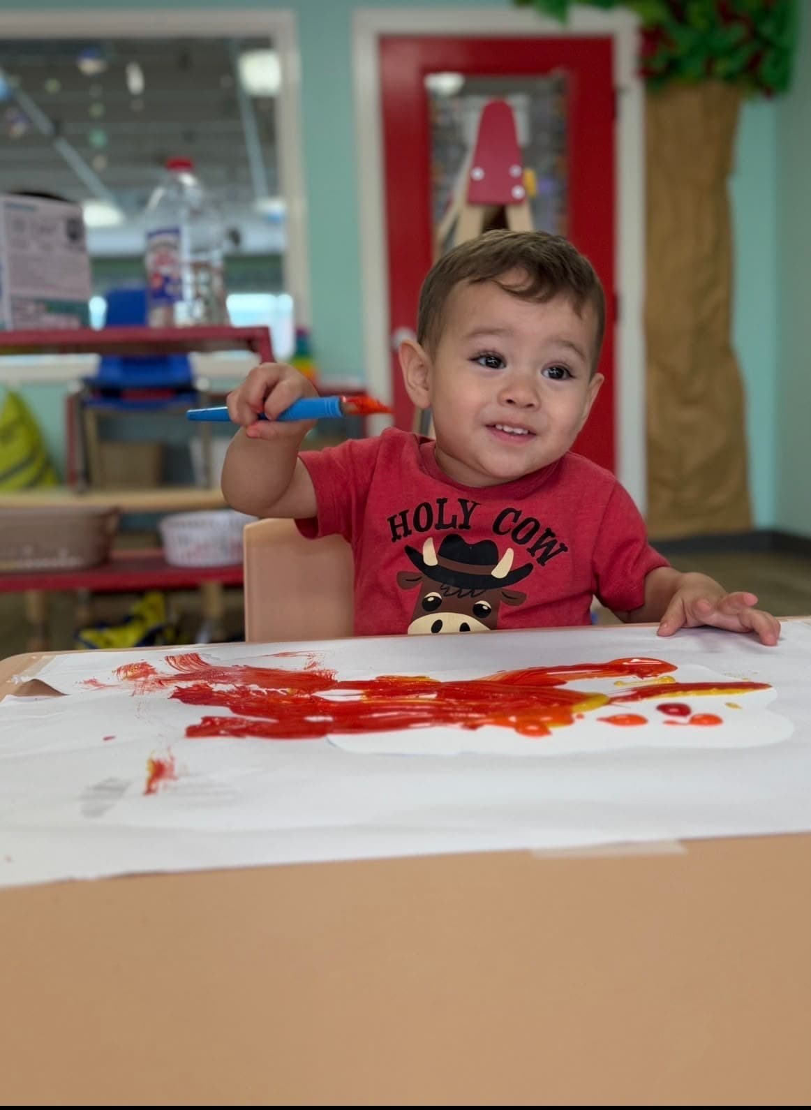 Toddler finger-painting during art time